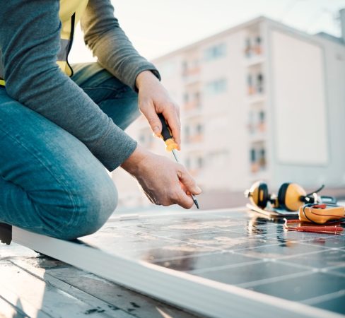 Solar panel, city and construction worker hands with tools for renewable energy and electricity. Co.